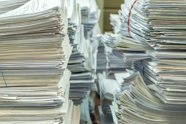 istock pile of paper documents in the office 1203775759