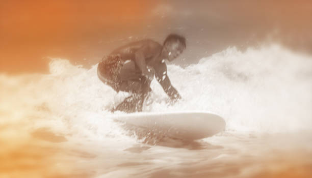 The blurry light design background of handsome man controlling longboard on sea wave,abstract art style,vintage tone