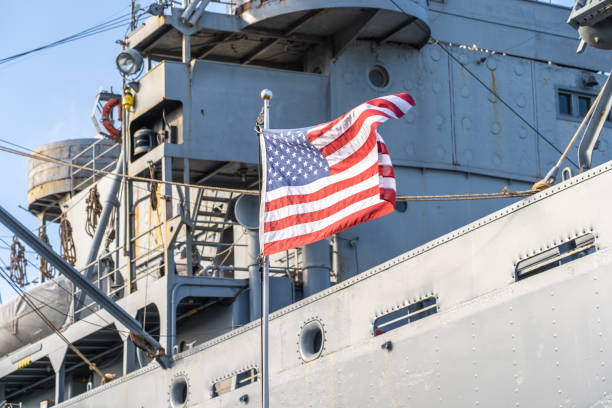 istock USA flag on a military ship 1203775877