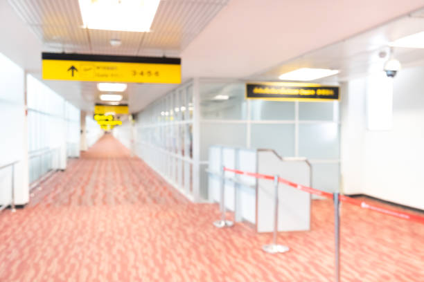 istock blur walkway in the building at night for abstract background. 1203776321