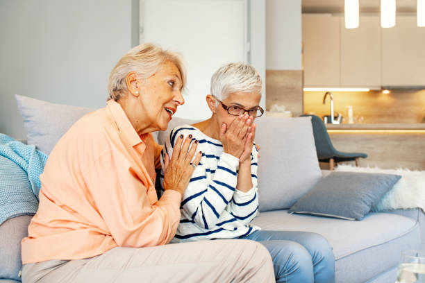 istock Senior woman comforts her friend 1203776997