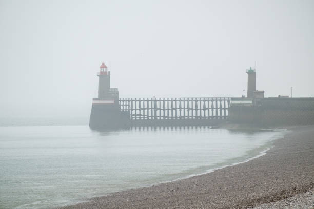 istock Normandy coast lighthouses on a misty day 1203777667