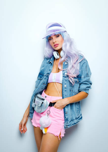istock Confident manga style young woman wearing oversized denim jacket 1203778670