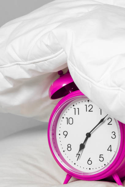 istock Alarm clock under the pillow - Don't want to wake up concept 1203778722