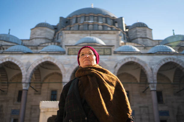istock Woman praying near a mosque 1203783381