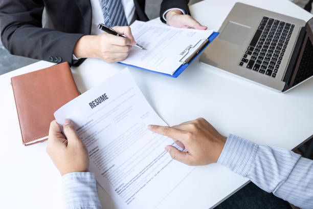 istock Businessman interview consider a resume conversation during about profile of candidate of conducting a job interview listen to answers while sitting at the working meeting in office 1203783578