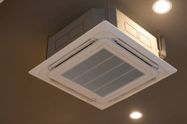 istock Air conditioner cassette type hang from white ceiling in building. 1203784523