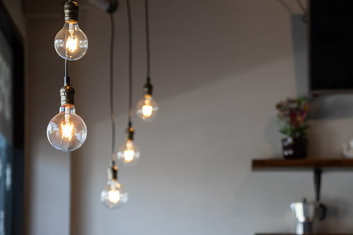 vintage light bulb hanging from ceiling for decoration in living room.