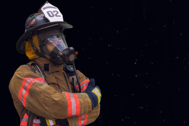 istock Firefighter in protective gear and oxygen mask. 1203784579