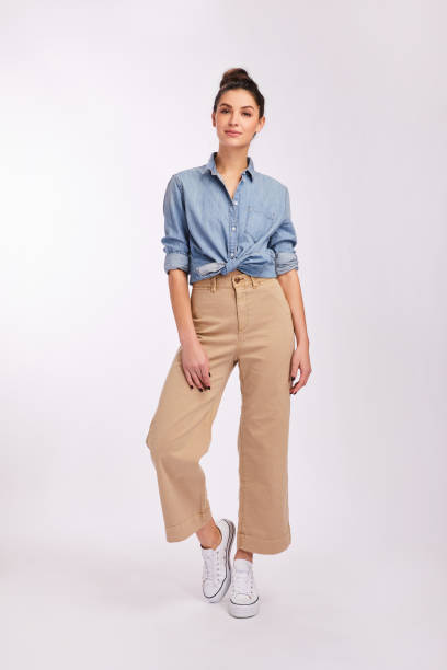 istock Confident young woman in smart casual clothes on gray 1203787155