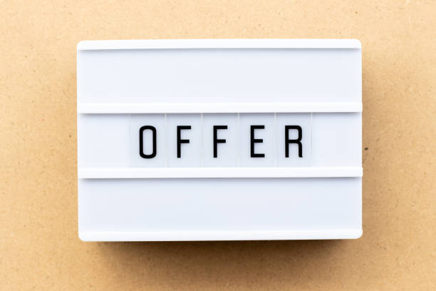 istock Light box with word offer on wood background 1203787414