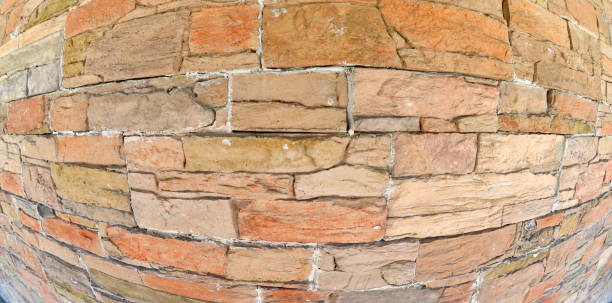 istock Brick wall photographed with a fish eye lens 1203788476