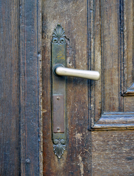 istock Door handle on the old wooden door 1203788502