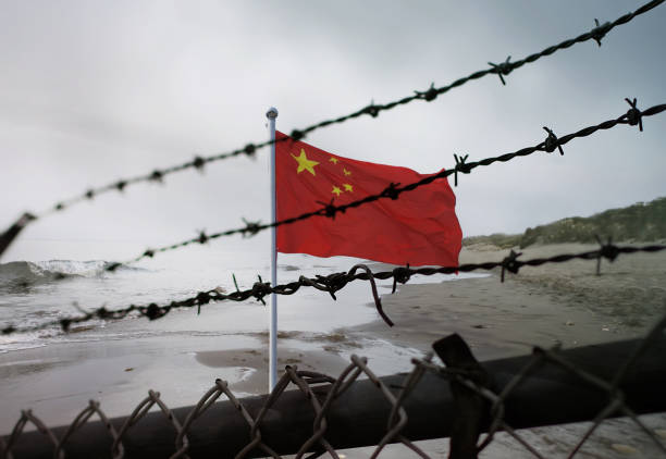 China border fence. Chinese flag behind a steel wire mesh China border fence. Chinese flag behind a steel wire mesh censorship photos stock pictures, royalty-free photos & images