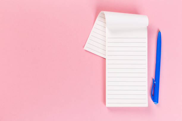 istock Sketchbook on colorful background. Copy space. top view of blank open notebook, concept of education or new workplace 1203789854