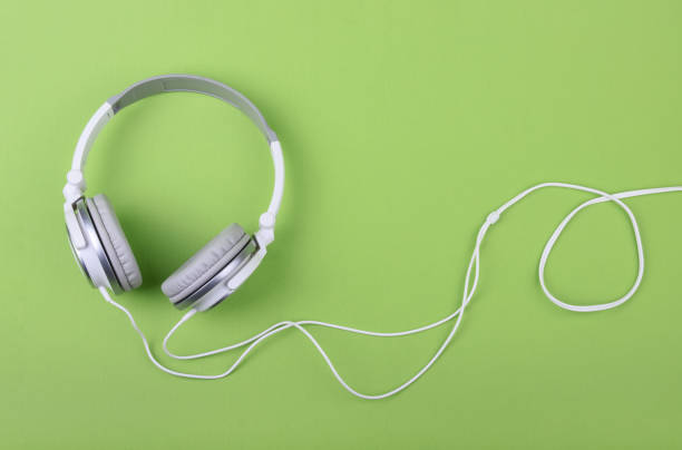 istock Headphones on green background copy space 1203790214