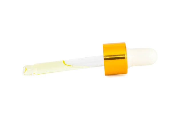 istock Small bottle of perfume isolated on a white background 1203793994