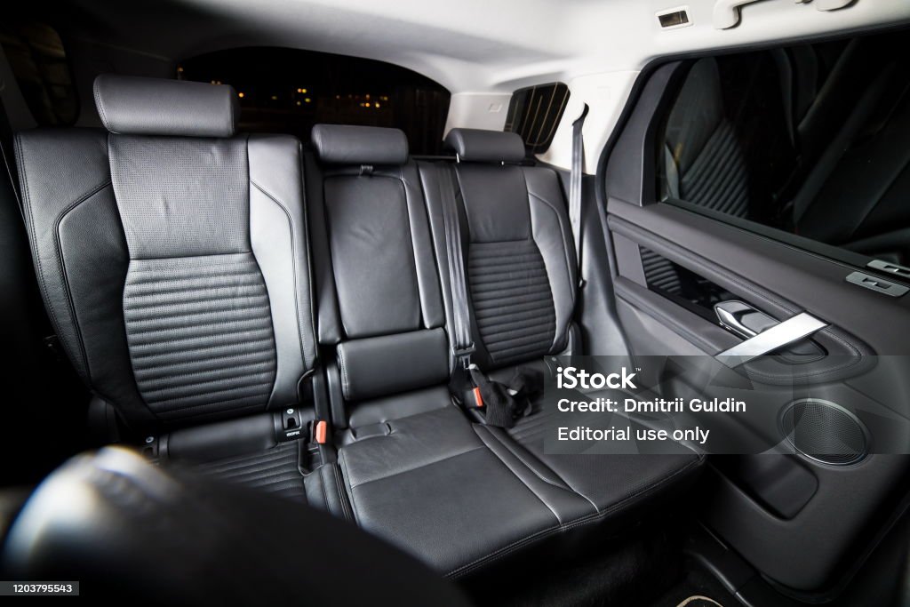 Rear seats and leather interior of a premium car Land Rover Discovery Sport 2020. Moscow, Russia - December 20, 2019: Rear seats and leather interior of a premium car Land Rover Discovery Sport 2020. Back Seat Stock Photo