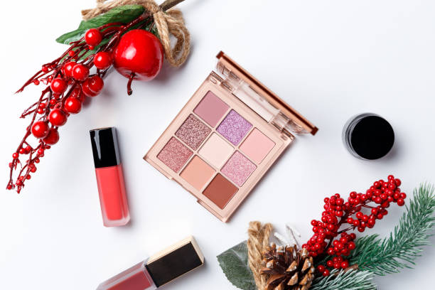 istock Set of professional elite decorative cosmetics for make-up on a white background with Christmas decorations. The concept of beauty and fashion. Fashion blog design. Top view. Flat lay 1203796736