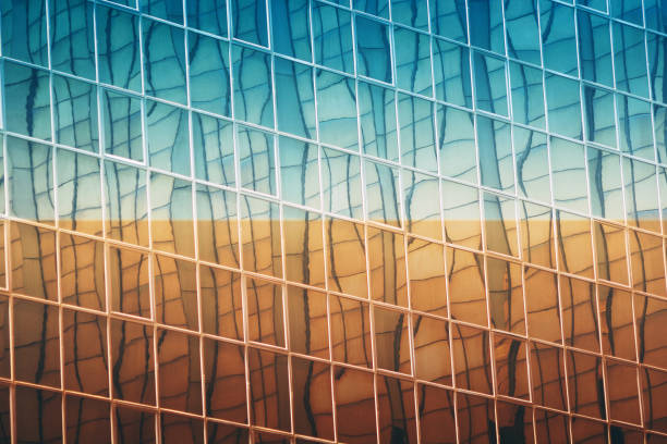 istock colorful Modern exterior architecture detail glass windows building texture 1203798529