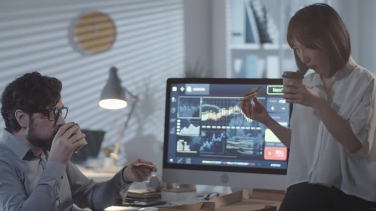 Coworkers Eating Pizza and Taking Break from Work