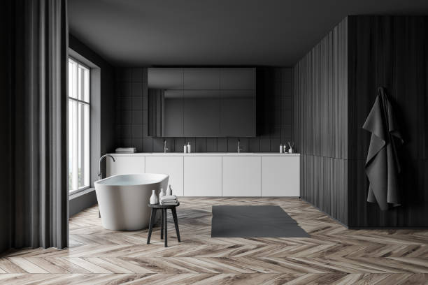 istock Gray and white bathroom with tub and sink 1203799813