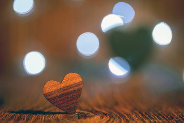 istock Wooden heart and blurry background 1203799914
