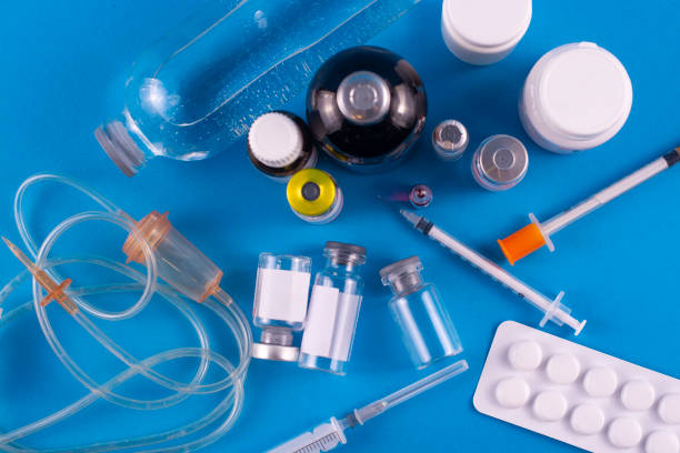 istock Various medical products on a blue background. View from above. 1203800080