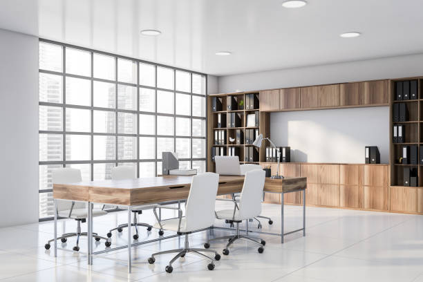 istock White and wooden CEO office corner with bookcase 1203801229