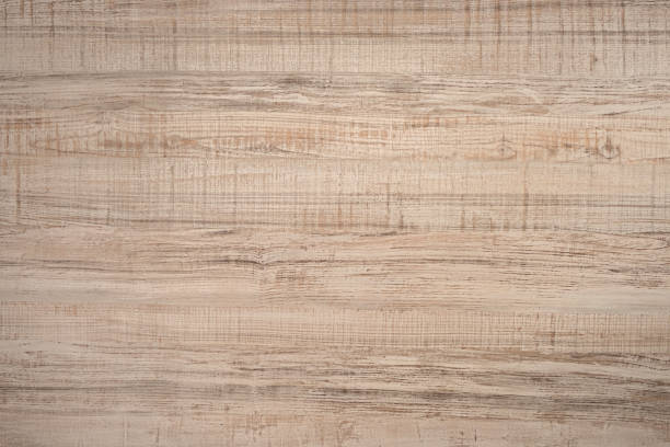 istock Textured wooden plank of light color as background 1203803603