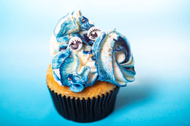 istock Food Frosted Cupcake with Funny Faces and googly eyes 1203804976