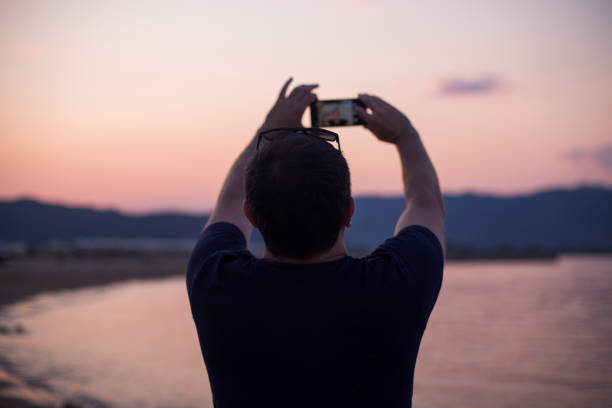 istock Sending photos from summer vacation 1203805601