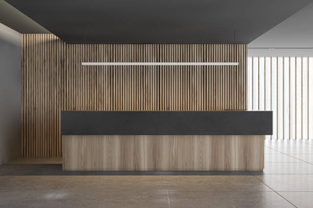 istock Wooden reception desk in corporate office 1203806945