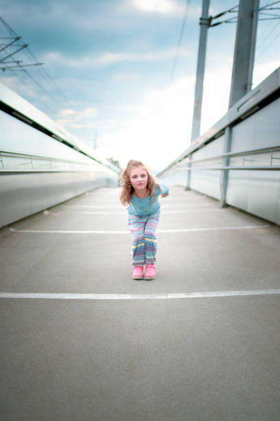 istock dancing jumping young girl 1203808347