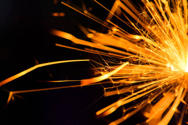 istock Sparks in the dark. Sparks. Christmas and New Year time. Magic light 1203808445