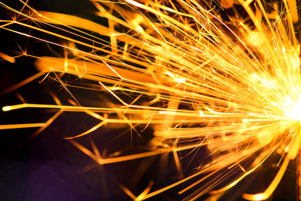 istock Sparks in the dark. Sparks. Christmas and New Year time. Magic light 1203808462