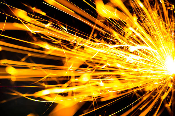 istock Sparks in the dark. Sparks. Christmas and New Year time. Magic light 1203808470
