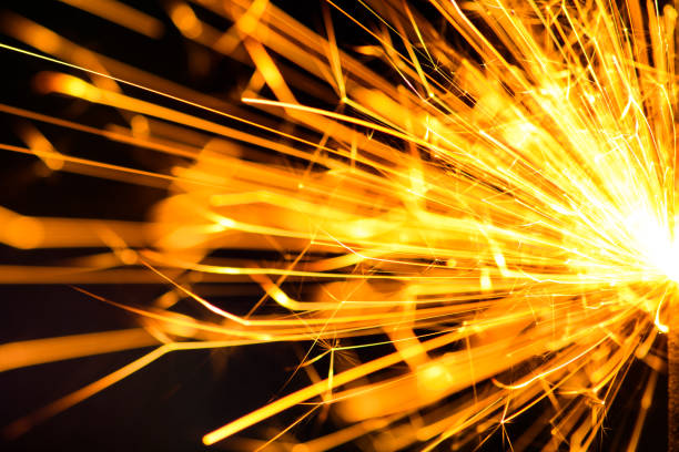 istock Sparks in the dark. Sparks. Christmas and New Year time. Magic light 1203808472