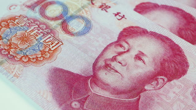 Close up of a rotating 100 Chinese Yuan banknote, 4k Resolution.