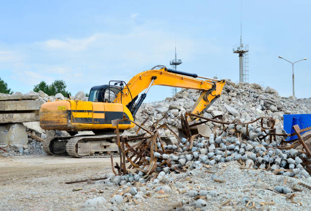 istock Excavator at Industrial landfill for the processing of old, old concrete structures 1203808745