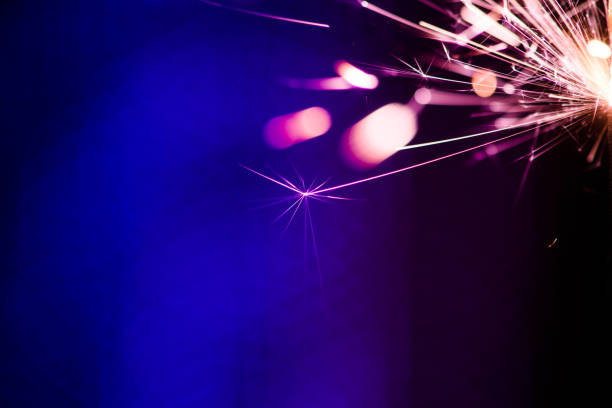istock Sparks in the dark. Sparks. Christmas and New Year time. Magic light 1203808746