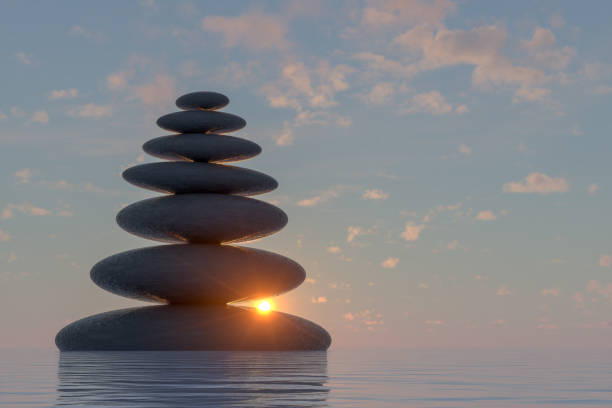 istock Balanced black color stones on sea, Teamwork Concept. 1203808769