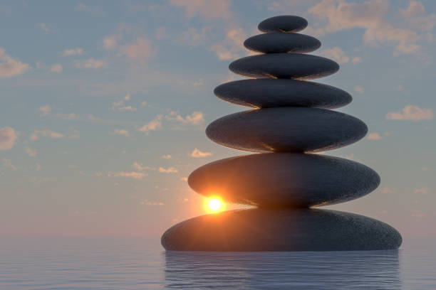 istock Balanced black color stones on sea, Teamwork Concept. 1203808840