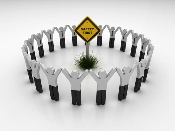 istock SAFETY FIRST Road Sign with Pictogram Teamwork People - 3D Rendering 1203810136