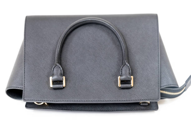 Black handbag closeup on the white background - Image