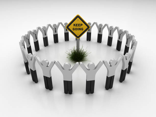 istock KEEP GOING Road Sign with Pictogram Teamwork People - 3D Rendering 1203811279