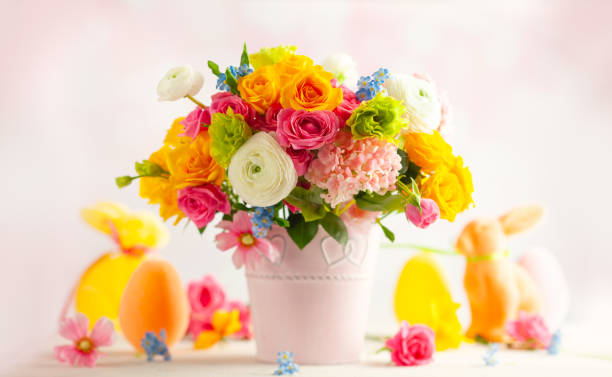 Bouquet of daffodils and ranunculus in a garden