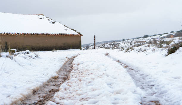 istock Old snowy houses 1203817852