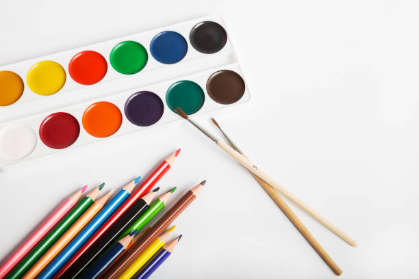istock Watercolor paints and color pencils 1203817879