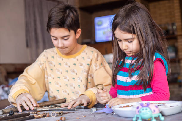 istock Brother and sister being creative together 1203817881